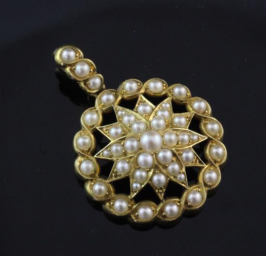 A Victorian style gold and split pearl set pendant, overall 1.5in.